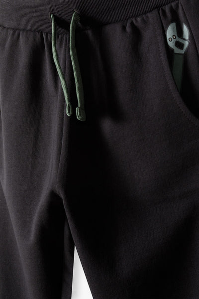 Graphite sweatpants with a key print in the pocket