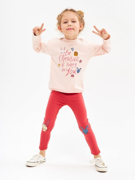 Girls' pink cotton blouse with a soft print