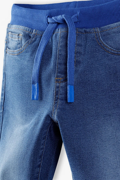 Jeans with drawstring at the waist