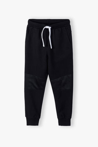 Cotton sweatpants with mesh on the knees - black