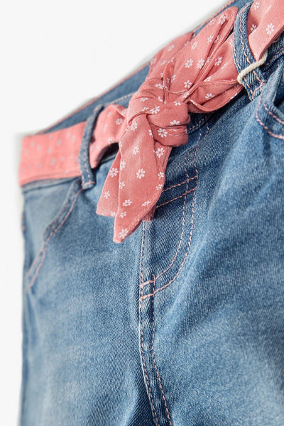 Girls' denim pants with a decorative pink ribbon