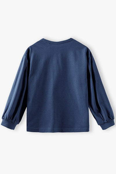 A blue cotton blouse for girls with a pocket and puffed sleeves