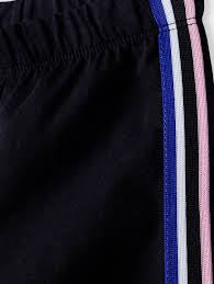 Girls' knitted leggings with a stripe - black
